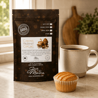 Thumbnail for Caramel Hazelnut Cupcake coffee bag next to a ceramic mug with a small cupcake and caramel drizzle on the side