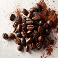 Thumbnail for A pile of roasted beans and coffee grounds on a light surface, ideal for brewing Chocolate Peanut Butter Silk Pie Coffee – A Luxurious Dessert in Your Cup 🍫🥜☕ or savoring its rich, dessert-inspired aroma.