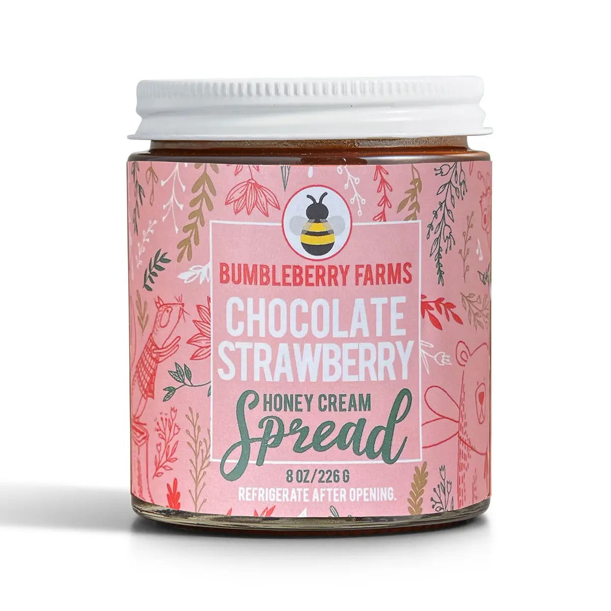 A white-lidded 8 oz (226 g) jar of Chocolate Strawberry Honey Cream Spread 🍓 – A Decadent Twist on a Classic Duo features a pink, nature-themed label with charming animal and plant illustrations and is made with wildflower honey.