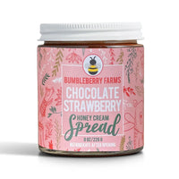 Thumbnail for A white-lidded 8 oz (226 g) jar of Chocolate Strawberry Honey Cream Spread 🍓 – A Decadent Twist on a Classic Duo features a pink, nature-themed label with charming animal and plant illustrations and is made with wildflower honey.