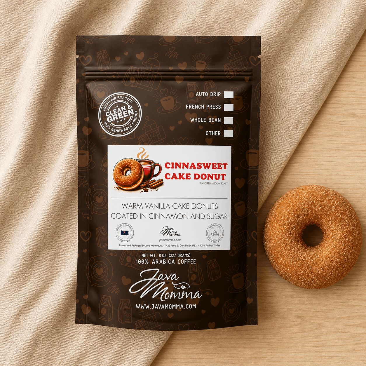 Overhead flatlay of Cinnasweet Cake Donut coffee bag with a cinnamon sugar cake donut