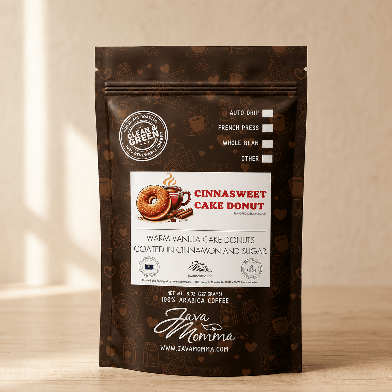 Java Momma Cinnasweet Cake Donut flavored coffee bag on a warm wood surface
