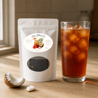 Thumbnail for Coco Nuttea Tea package with a glass of iced tea on a wooden surface with a piece of fresh coconut

