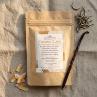 Thumbnail for Coconut Cloud loose leaf white tea bag on natural linen with toasted coconut flakes, a vanilla bean, and white peony tea leaves