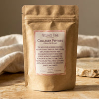 Thumbnail for Kraft paper package of 'Feeling Fine' collagen peptides on a wooden surface with a beige towel in the background.