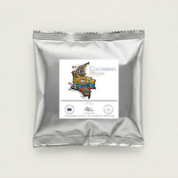 Thumbnail for A silver, foil coffee packet, flat lay on a white background, featuring a clean label that says 