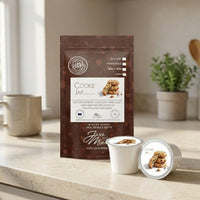 Thumbnail for Cookie jar coffee package with a cup and container on a wooden surface.