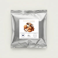 Thumbnail for Silver foil 2 ounce sample packet of Java Momma Cookiedoodle flavored medium roast coffee centered on a minimalist white background.