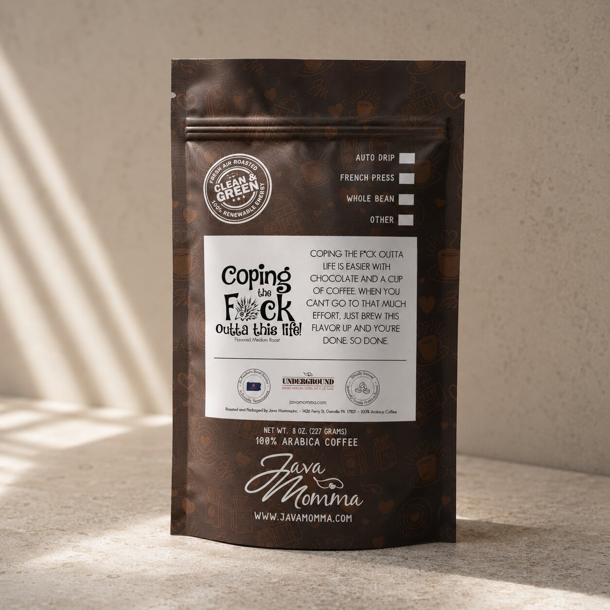Bag of Java Momma Coping the F%k Outta This Life coffee on a warm wood surface