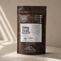 Thumbnail for Bag of Java Momma Coping the F%k Outta This Life coffee on a warm wood surface