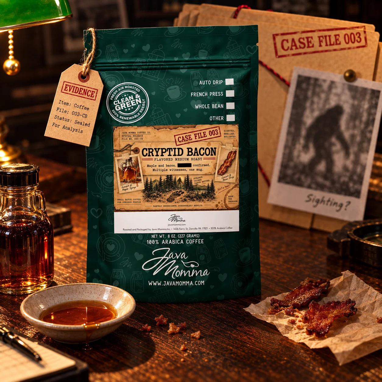 Cryptid Bacon Coffee | Momma's Picks package with bacon, maple, and coffee evidence on a rustic table.