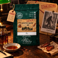 Thumbnail for Cryptid Bacon Coffee | Momma's Picks package with bacon, maple, and coffee evidence on a rustic table.