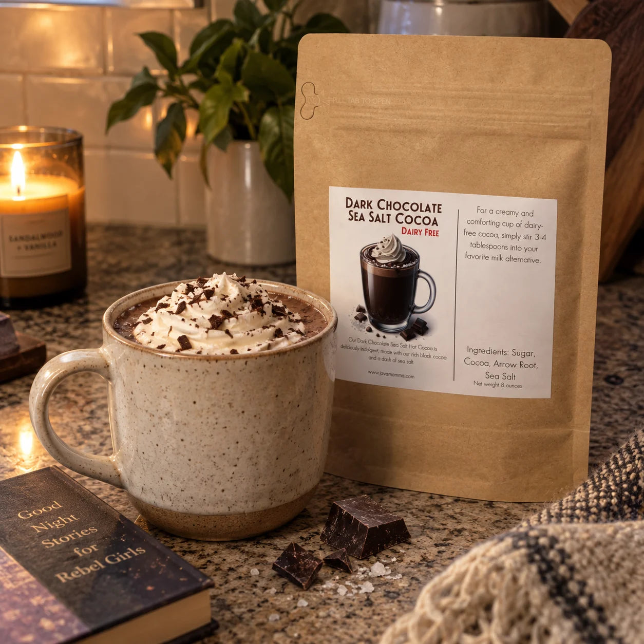 Dairy Free Dark Chocolate Sea Salt Hot Cocoa Mix in a cozy setting with a mug topped with whipped cream.