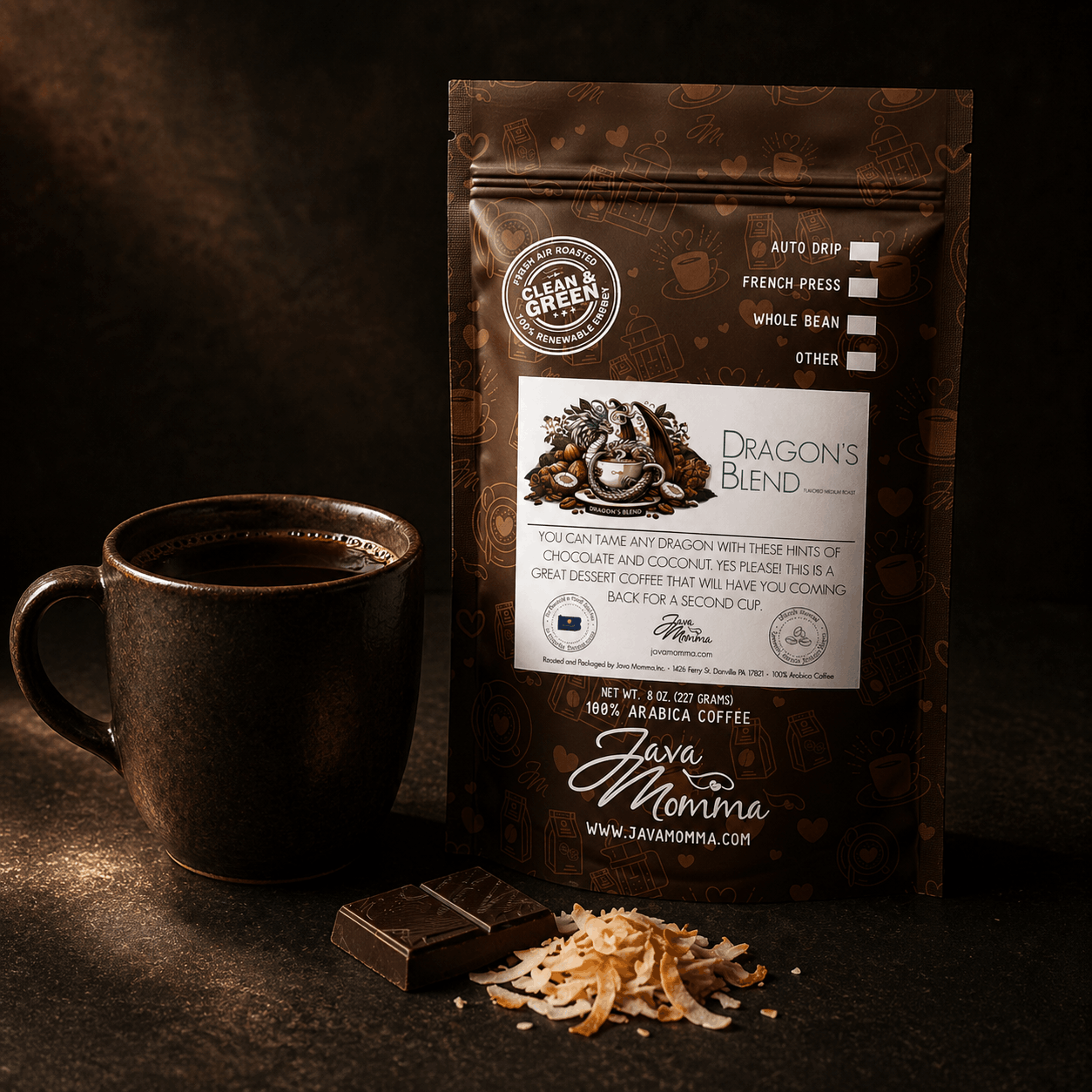 Dragon's Blend coffee bag next to a ceramic mug with dark chocolate pieces and toasted coconut on the side