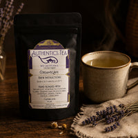 Thumbnail for Dreamscape Authentici-tea package with a steaming mug and lavender flowers on a wooden surface