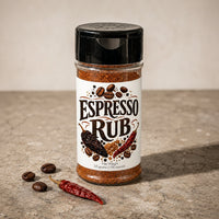 Thumbnail for Bottle of Espresso Rub with spices on a stone surface, perfect for grilling and enhancing flavors.