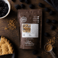 Thumbnail for Java Momma Forest Berry Pie coffee package on a wooden surface with blackberries and pie