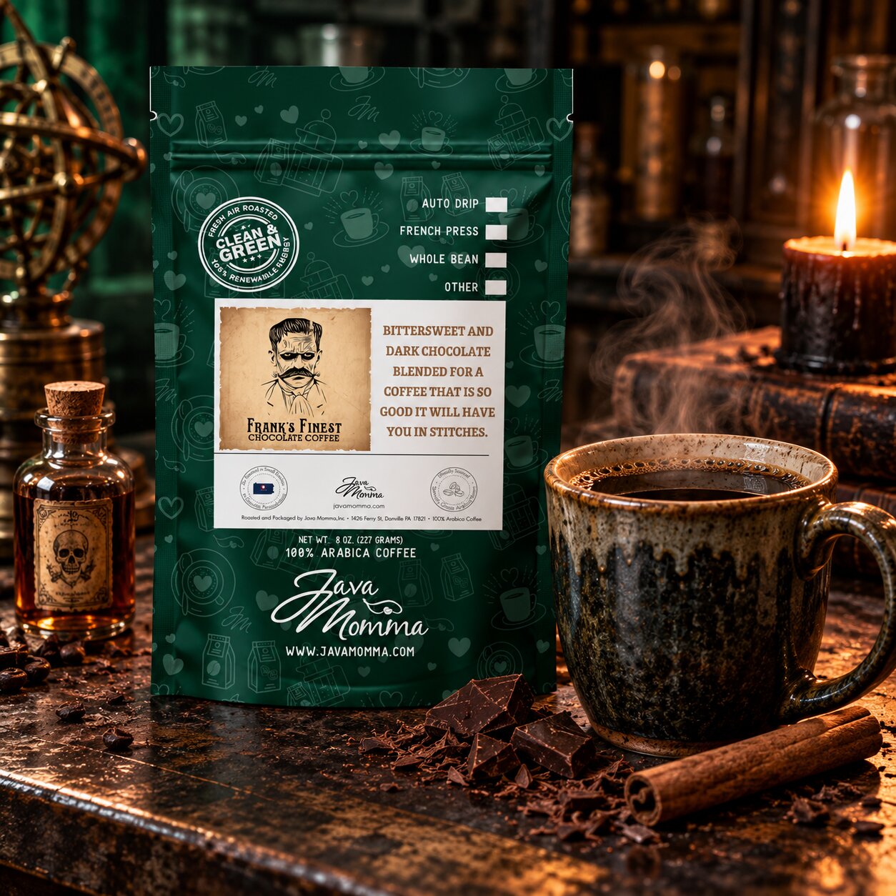 A stand-up pouch of Frank's Finest Coffee by Java Momma sits on a rustic countertop beside a steaming ceramic mug, a lit candle, chocolate pieces, cinnamon sticks, and small bottles in a warm, moody kitchen setting.