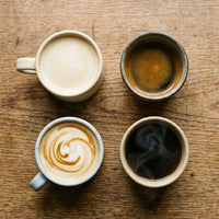Thumbnail for overhead image of four coffee mugs with different coffee variations