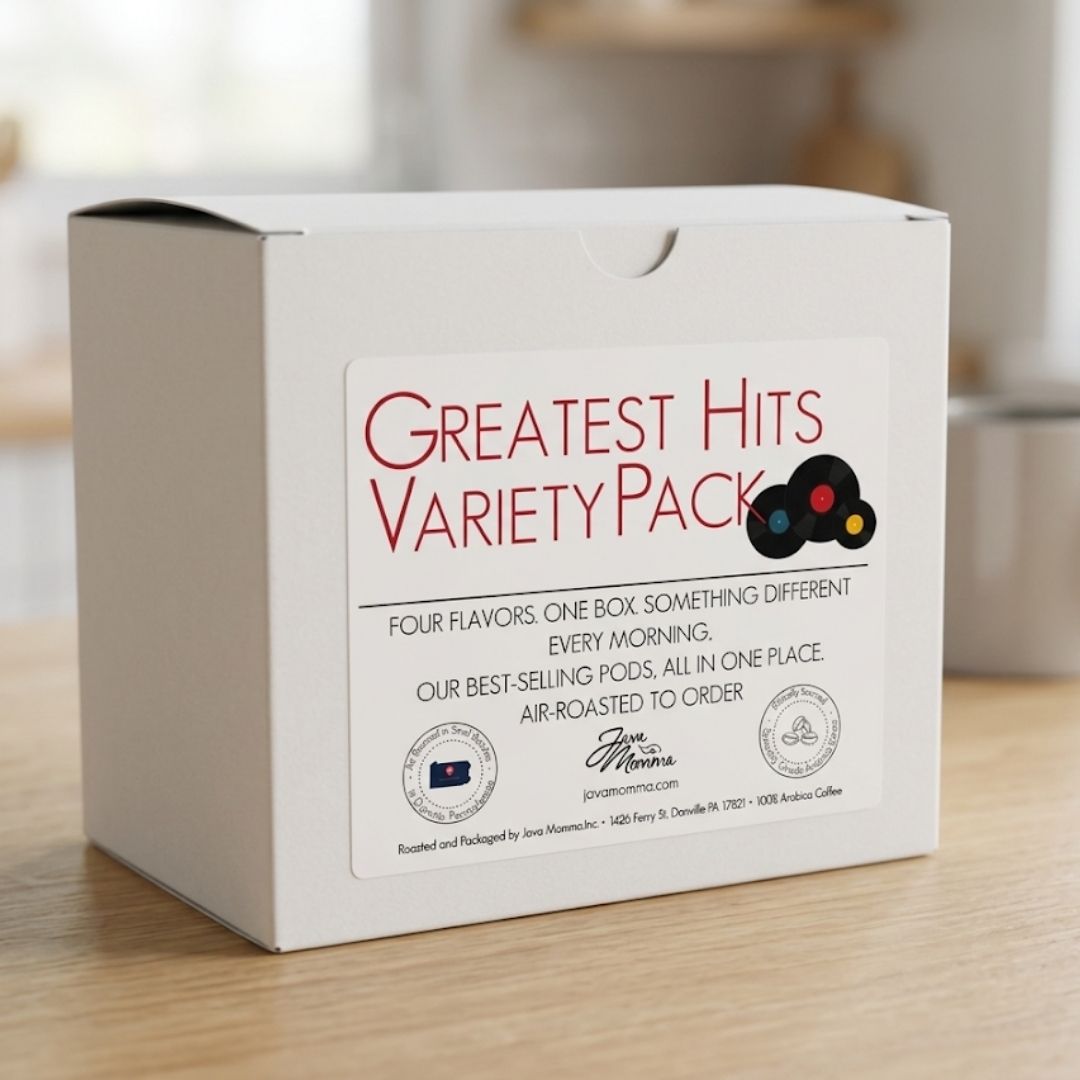 White coffee pod variety pack box on a wooden surface with a blurred background Greatest Hits Variety Pack on label