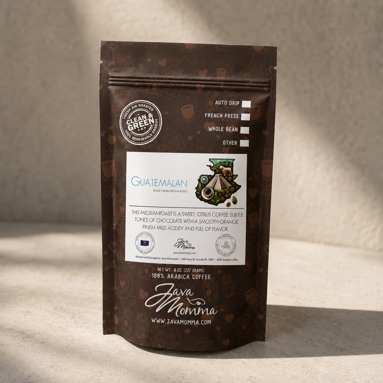 Bag of Java Momma Guatemalan Medium Roast coffee on a warm wood surface
