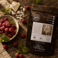 Thumbnail for Hex Appeal Flavored Coffee bag with sweet white chocolate and tart raspberry on rustic wood background.