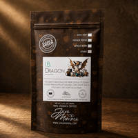 Thumbnail for Java Momma I.B. Dragon Brazilian dark roast coffee bag on a dark wood surface