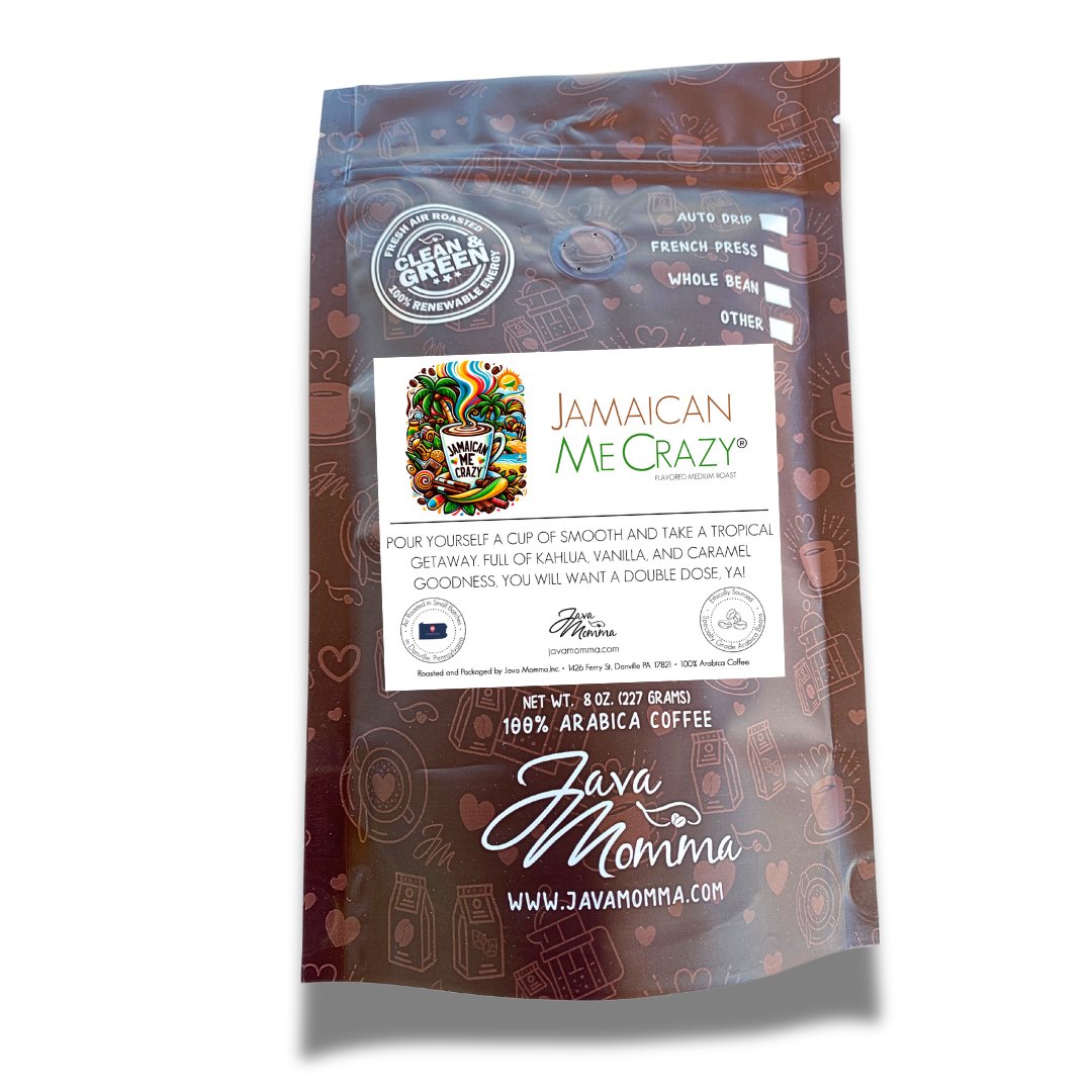 A brown bag of 🌴 Jamaican Me Crazy® Coffee – Tropical Escape in a Cup, featuring a colorful cup illustration. The label highlights medium roast 100% Arabica beans with caramel and vanilla flavors, plus brewing method icons.