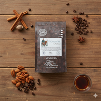 Thumbnail for Overhead flat lay of Java Momma Highlander Grogg coffee bag on a rustic wood table, styled with cinnamon sticks, nutmeg, star anise, roasted nuts, coffee beans, and a glass of rum — highlighting buttery rum, warm spice, and nutty flavor notes.