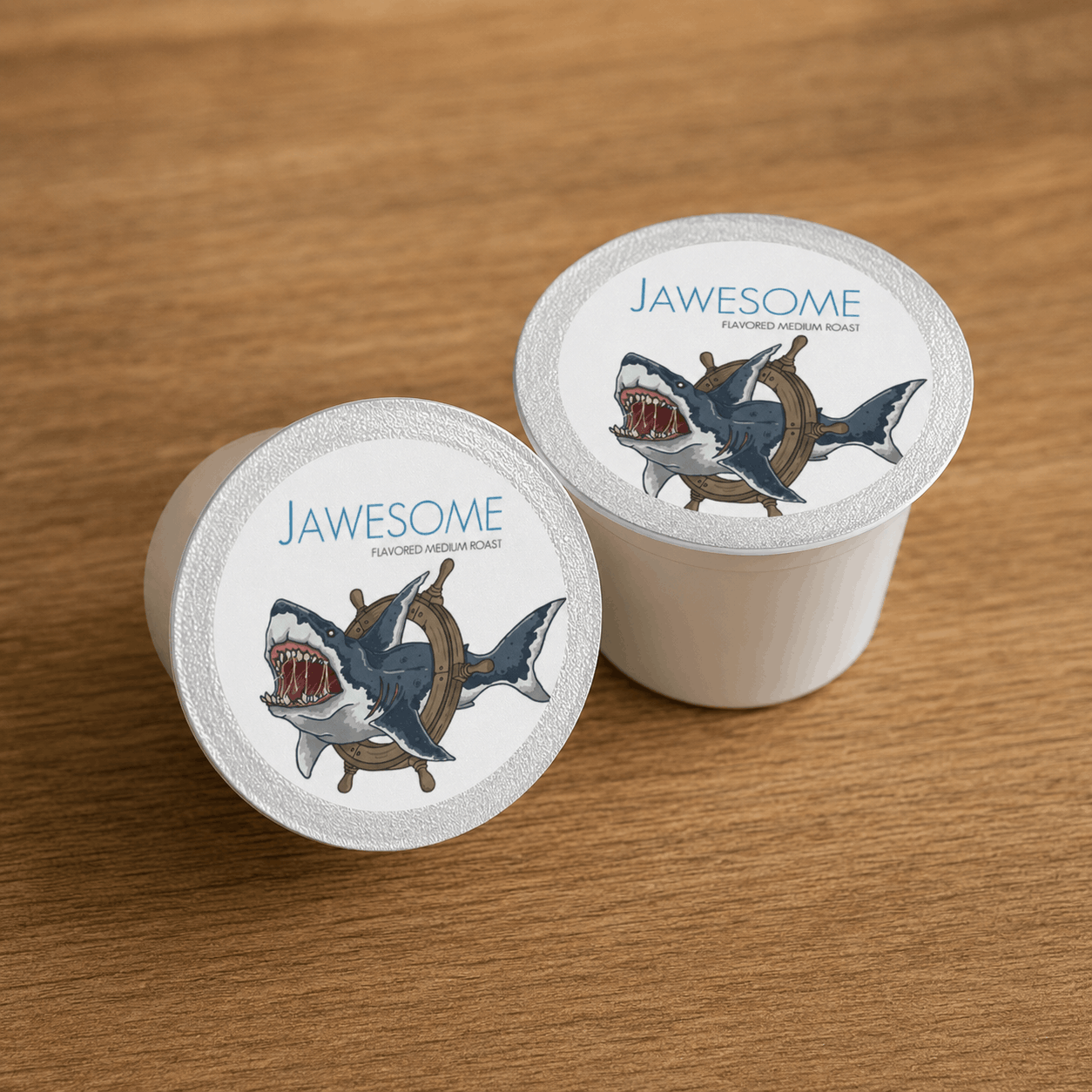 jawesome flavored coffee single serve pods on wooden surface
