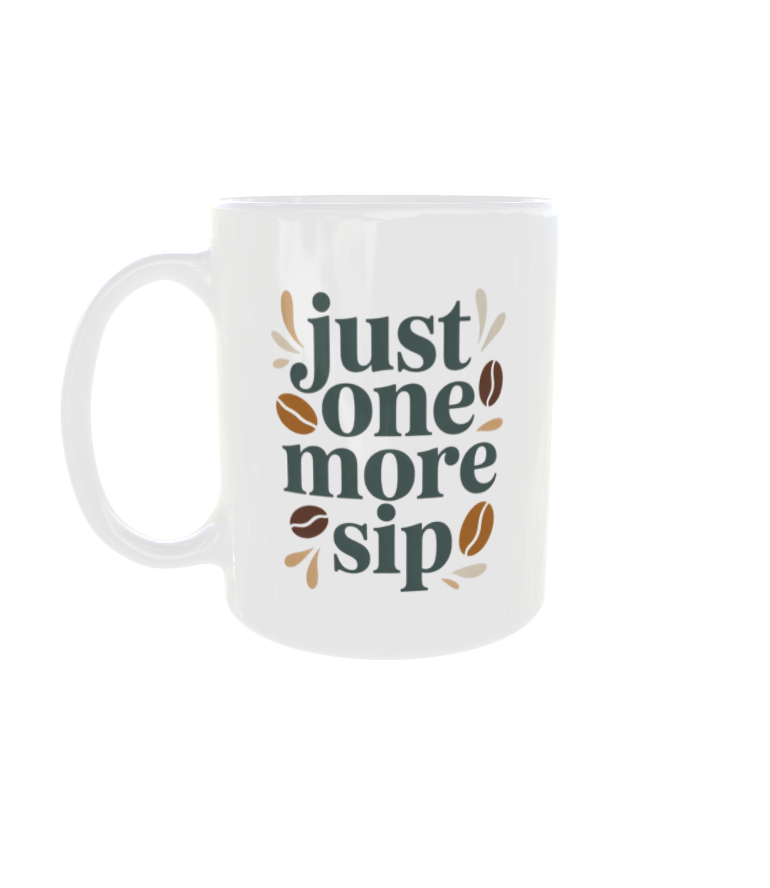White ceramic coffee mug with the text "Just one more sip" in teal and brown vintage typography, surrounded by coffee beans.