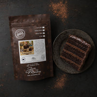 Thumbnail for Java Momma Layer Cake coffee package with a slice of chocolate cake on a dark surface