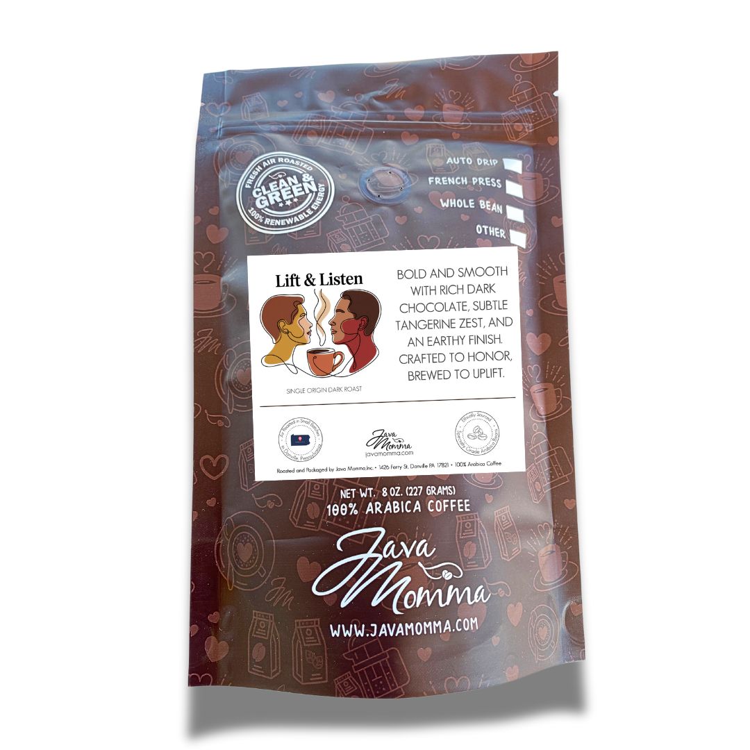 A maroon Java Momma bag labeled ✊🏾 Lift & Listen – A Juneteenth Roast with Purpose features a bold, smooth limited-edition coffee with dark chocolate, tangerine zest, and earthy notes. Brewing methods and javmomma.com appear on the package.