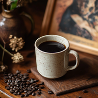 Thumbnail for A speckled ceramic mug of ✊🏾 Lift & Listen – A Juneteenth Roast with Purpose rests on a wooden surface beside coffee beans, dried flowers, and a blurred photo in the background—a tribute to Black history celebration.