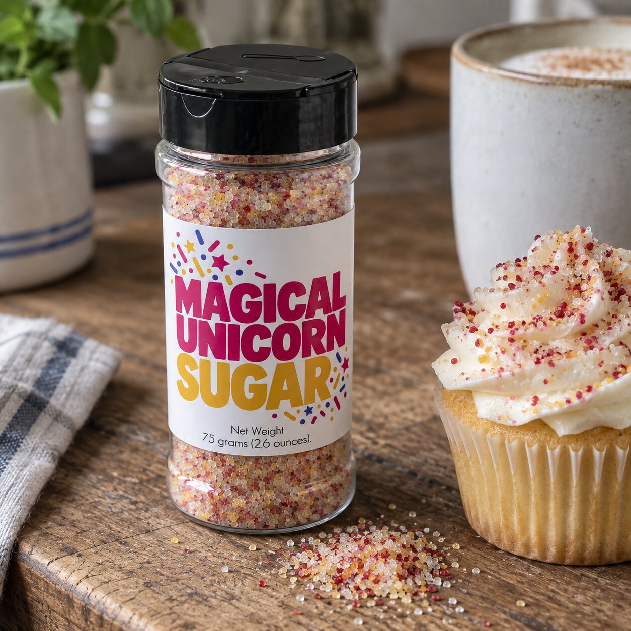 Magical Unicorn Sugar Sprinkle jar beside a cupcake decorated with the whimsical and colorful sugar.