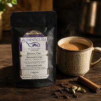 Thumbnail for Authentici-Tea Masala Chai package with a steaming cup of tea on a wooden surface.