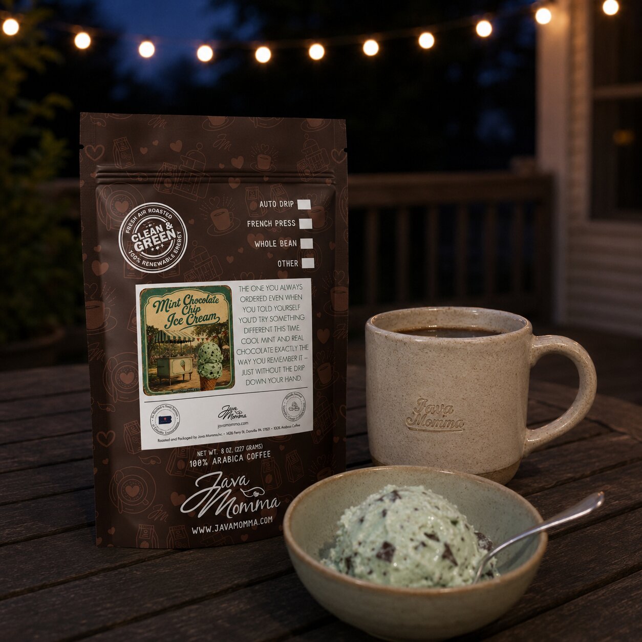 Java Mama Mint Chocolate Chip coffee package with a cup of coffee and bowl of ice cream on a wooden surface at night.