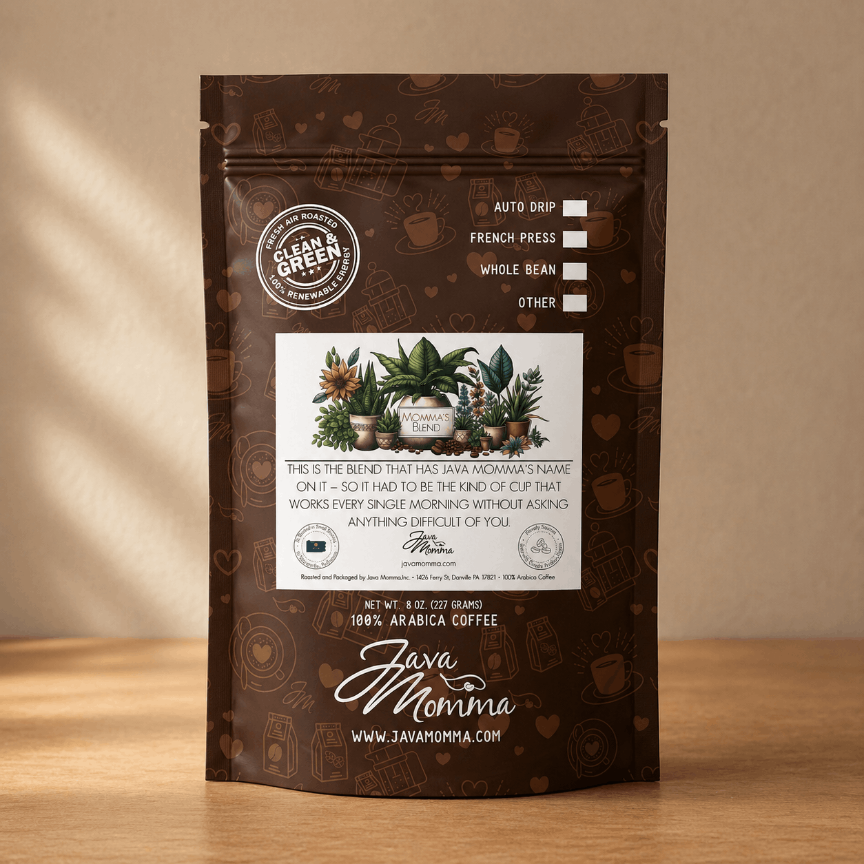 Java Momma Momma's Blend coffee bag standing upright on a warm wood surface in soft natural side light