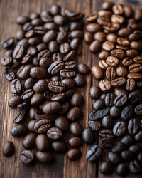 Thumbnail for Close-up of dark and medium roast coffee beans in separate clusters on a dark wood surface showing roast level variation
