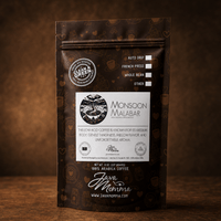 Thumbnail for Java Momma Indian Monsoon Malabar dark roast coffee bag on a warm wood surface
