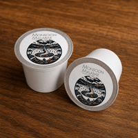 Thumbnail for Monsoon Malabar coffee pods on wooden surface
