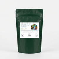 Thumbnail for Green decaf java momma coffee package with a label on a white background
