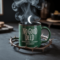 Thumbnail for Emerald green coffee mug with thorny vines and crescent moon steam, labeled No Good Deed – chocolate and coconut flavored Wicked-inspired coffee.