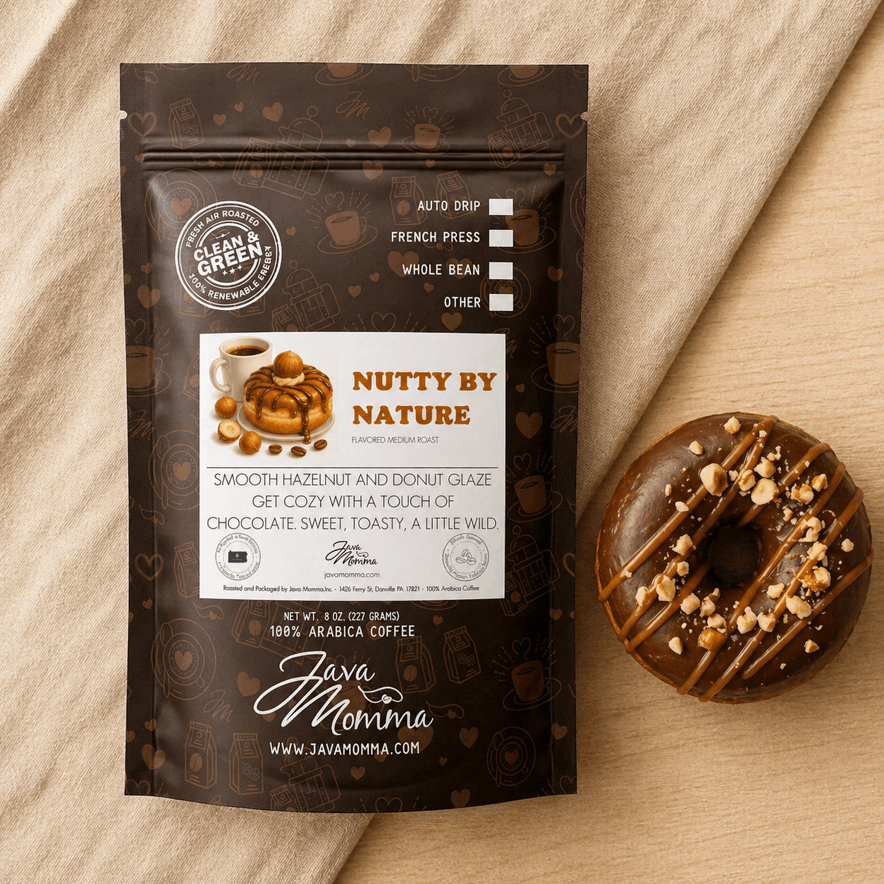 Overhead flatlay of Nutty by Nature coffee bag with whole hazelnuts, a vanilla bean, and caramel drizzle