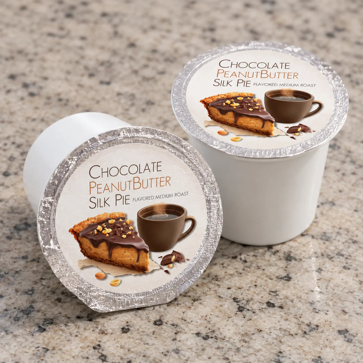 Two single-serve coffee pods for Chocolate Peanut Butter Silk Pie, displayed on a speckled granite countertop.