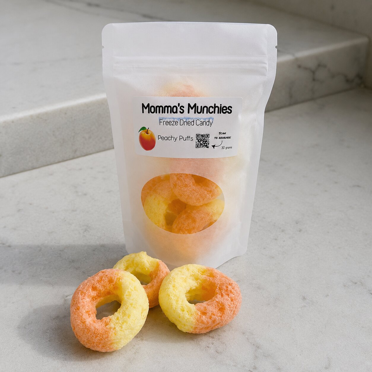 Packaged candy with 'Momma's Munchies' branding on a marble surface