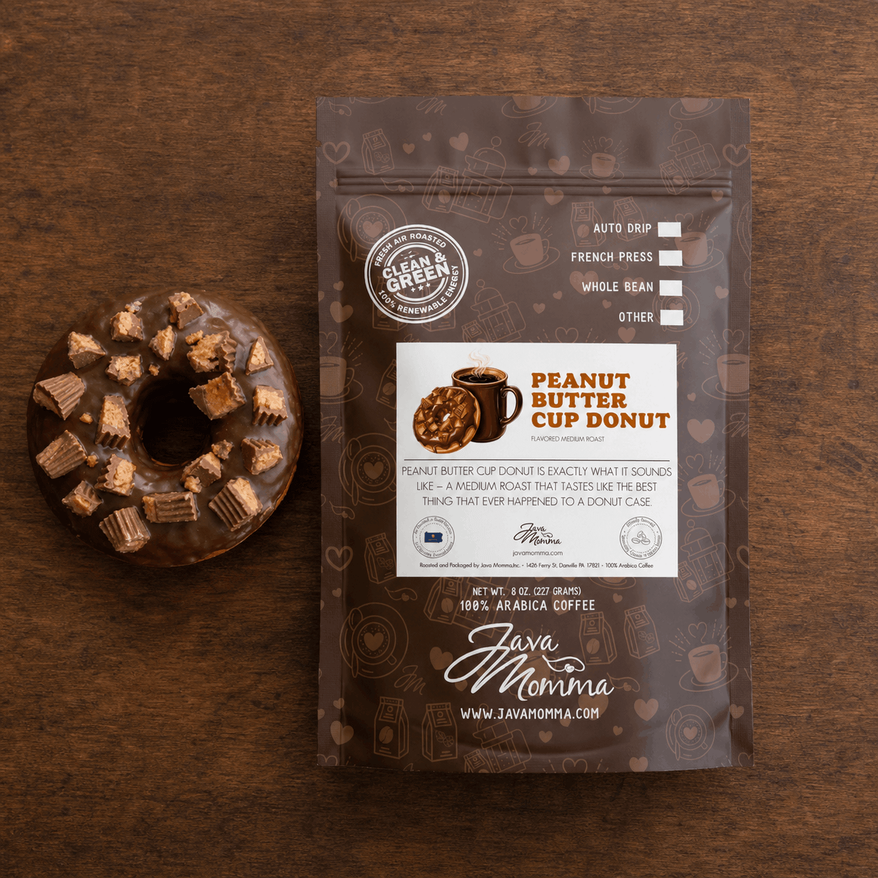 Overhead flatlay of Peanut Butter Cup Donut coffee bag with a chocolate glazed donut topped with chopped peanut butter cup pieces