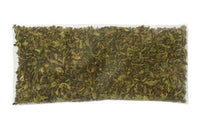 Thumbnail for A clear plastic bag of Mint Condition Refreshing Peppermint Cold Brew Tea, filled with dried, crushed green herbs—ideal for making invigorating peppermint herbal tea—shown from above on a white background.