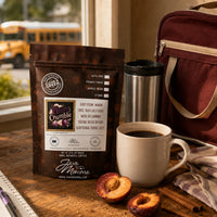 Thumbnail for Plum Crumble Coffee | Momma's Picks bag with coffee cup and plums, showcasing juicy plum and warm spice flavors.