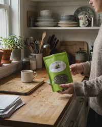 Plot Twist Mint Tea | Darjeeling & Peppermint Black Tea Blend in a kitchen setting, showcasing the tea package.